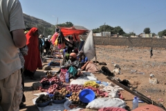 Yet they are selling vegetables and food items next to the public field that is a bathroom