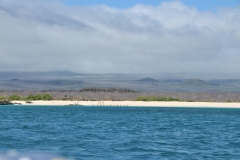 Ruins of the lookout pier on the beach in the distance