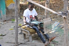 Here we are at a tourist attraction that has been set up to be more akin to an African hamlet - a 'living museum' of sorts.  The center piece of the various exhibits is a reconstruction of a traditional Mandinka compound, depicting how they lived over 100 years ago.  Here we see a demonstration of how they used a loom.