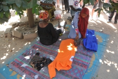 Demonstration of ironing. Notice there is no electricity.