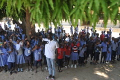 The Principal of the school waving goodbye to us  along with the students.