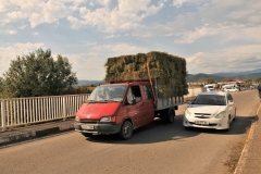 Nothing like a little bit of hay on a truck bed passing over a bridge.