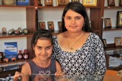 Two young sisters in the gift shop and office of the entrance of the Monastery.