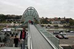 The Bridge of Peace is a bow-shaped pedestrian bridge, a steel and glass construction illuminated with numerous LEDs, over the Kura River in downtown Tbilisi, capital of Georgia.