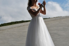 Interesting photo of the Bride with her phone in hand when she is surrounded with the beauty of mother nature all around. Where was the groom?