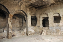 The Uplistsikhe complex can tentatively be divided into three parts: south (lower), middle (central) and north (upper) covering an area of approximately 8 hectares. The middle part is the largest, contains a bulk of the Uplistsikhe rock-cut structures, and is connected to the southern part via a narrow rock-cut pass and a tunnel. Narrow alleys and sometimes staircases radiate from the central "street" to the different structures.