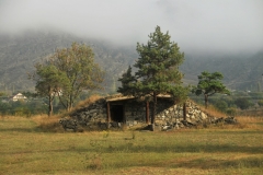 Ruins of an old house with a  grass roof for warmth in the cold winters