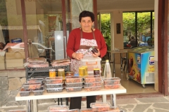 A local selling her homemade products to anyone stopping to try a sample.