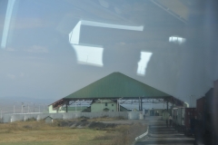 The last 5 miles of road from Georgia to Armenia was dodging pot holes and  unpaved road. Very Surprising.  This is the border building leaving Georgia.