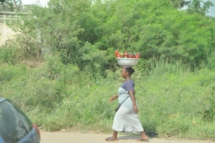 Try balancing all those bottled drinks  and walking in flip flops over uneven roads.