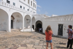 In the tiled outside area in the far distance is an Arch.  This leads to a photo, 2 photos after this one to the "Door of no return".  They were loaded on boats and never to return to the Continent of Africa.