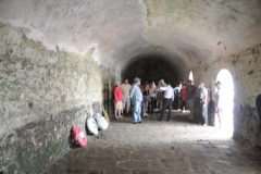 Elmina Castle Slave Holding Cell. Elmina, like other West African slave fortresses, housed luxury suites for the Europeans in the upper levels. The slaves were kept in cramped and filthy cells below, each cell often housing as many as 200-600 people at a time, without enough space to even lie down