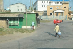 Just whenyou think you have seen everything here is another.  A  person carrying three items on his head.