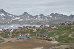 Tasiilaq is located approximately 70 miles south of the Arctic Circle, on the southeastern coast of Ammassalik Island, on the shore of a natural harbour in Tasiilaq Fjord,  The fjord is an inlet of the long Ammassalik Fjord emptying into the North Atlantic to the east of the town.