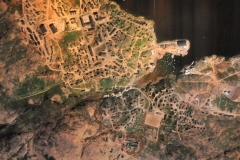 This is an aerial view of Tasiilaq, a photo in the hotel lobby,  with the red circle indicating where the hotel is located.
