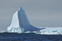 Because the density of pure ice and of the seawater, typically about one-tenth of the volume of an iceberg is above water.