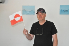 Beggi holding the flag of Greenland