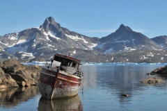 The remains of a former fishing boat now beached next to the Helicopter airport.