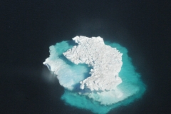 Looking down from the air on Icebergs and enjoying the beauty of them. .