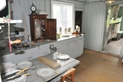Thousands of people flocked to Siglufjörður each herring season in search for a well paid job; herring girls, fishermen and other workers. Hundreds of herring girls came from around the country to work during the summer, and they would be housed in the stations where they were employed. So on the upper floor the living quarters are still standing, untouched – and it feels like the girls just ran out for work.