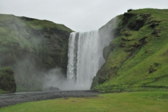 Skógafoss is one of the biggest waterfalls in Iceland, with a drop of some 180 feet and a width of 75 feet , and you can walk right up to it, but be prepared to be drenched. It is just overwhelming standing next to it.