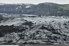Cryoconite is powdery windblown dust made of a combination of small rock particles, soot and bacteria. The dark dust, which is spread over glaciers in Iceland  and other icy areas of the world by wind and rain, is composed of mineral dust from warmer regions of the world, rock particles from volcanic eruptions, and soot from fires.
