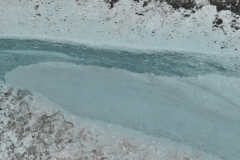 Why is glacier ice blue? Glacier ice is blue because the red ,long wave lengths, part of white light is absorbed by ice and the blue, short wavelengths, light is transmitted and scattered. The longer the path light travels in ice, the more blue it appears.