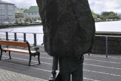 Iceland has a sculpture honoring — and lightly satirizing — the thankless, anonymous job of the bureaucrat. The 1994 sculpture by Magnús Tómasson depicts a man in a suit holding a briefcase, with his head and shoulders buried in a slab of unsculpted stone.