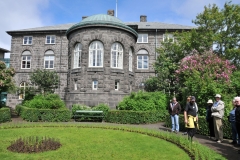 Back of the Parliament building with a small park