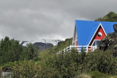 Our ultimate destination  while hiking this morning along the dramatic rocky coastline followed by lunch in the Hellnar Valley. We spot a red house with a blue roof in the middle of no where.