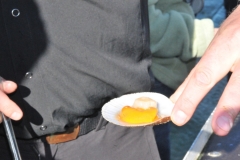 Scallops are characterized by offering two flavors and textures in one shell: the meat, called "scallop", which is firm and white, and the roe, called "coral", which is soft and often brightly coloued reddish-orange