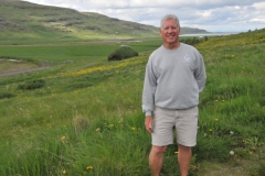 Yes in Iceland I wore shorts too. It did not matter what the temperature. I climbed up on a hill to get a perspective of the land.  You can see the Longhouse in the back ground.  Also from this location you can see how close they were to the sea also. A very interesting morning..