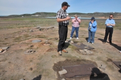 Beggi explaining the pseudo crater field formed by steam explosions when lava flowed over wet earth at Skutustadir.