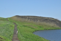 Walking by a large crater left by explosions millions of years ago.