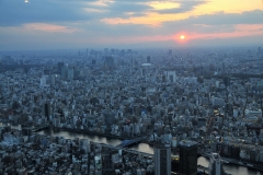 The First observation deck at 1,050 feet, 350 meters, Tembo Deck the lower of the 2 decks spans 3 levels with great views from all its floors. See it from this level at sunset over Tokyo.