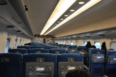 Inside the train seats have high seat backs. Inside the cars there is relatively no sound at all. The countryside flashes by in an instant. If you try to take a photo in a station as a train approaches and goes directly through the station it is almost impossible to get any photo at all. It approaches and by the time you snap the photo the train is almost out of sight. The train car inside looks empty but really the majority of all seats are booked with passengers. The train literally floats as it travels especially on curves. Incredible engineering.