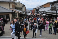 Thousands of tourists and Pilgrims daily flock to the family Kiyomiizu-dera temple. A magnificent large wooden temple supported by pillars off the slope of a mountain.