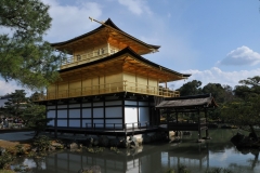 This is the rear view of the Pavilion. The Golden Pavilion is set in a magnificent Japanese strolling garden. The pond contains 10 smaller islands.