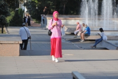 A local young lady in colorful dress