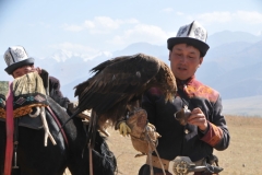 Placing the hood on the Eagle to keep it from having sight.