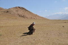 He rewards the eagle with raw meat.