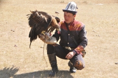 “We take the eagles from their nests when they are very young," he explains while he continues to feed the eagle chunks of meat. “We try to take only the females and then we train them and keep them for no more than 15 years.”