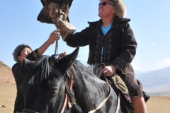 I thought just seeing these magnificent birds in the wild was our reward today. But know we are offered the chance to actually hold a Golden Eagle on your arm and on a horse. Can it get any better?
