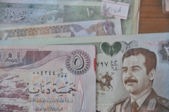 Old currency from Iraq with Saddam Hussan's photo on it