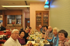 Travel group having dinner in a local restuarant