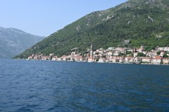 Perast is a picturesque, historic town in the Bay of Kotor, Montenegro, known for its well-preserved Baroque architecture, numerous churches, and grand palaces, reflecting its past maritime significance under the Venetian Republic. 