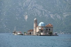 Our Lady of the Rocks is one of the two islands off the coast of Perast in the Bay of Kotor, Montenegro. It is an artificial island created by bulwark of rocks and by sinking old and seized ships loaded with rocks.