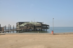 The bay is a safe haven for sea vessels because of its natural deep-water harbour, protected by the Pelican Point sand spit, being the only natural harbour of any size along the country's coast.