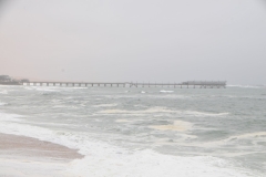 Another view of the pier from the beach area and condo and restaurant area.