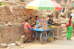 On the street just outside the restaurant entrance
